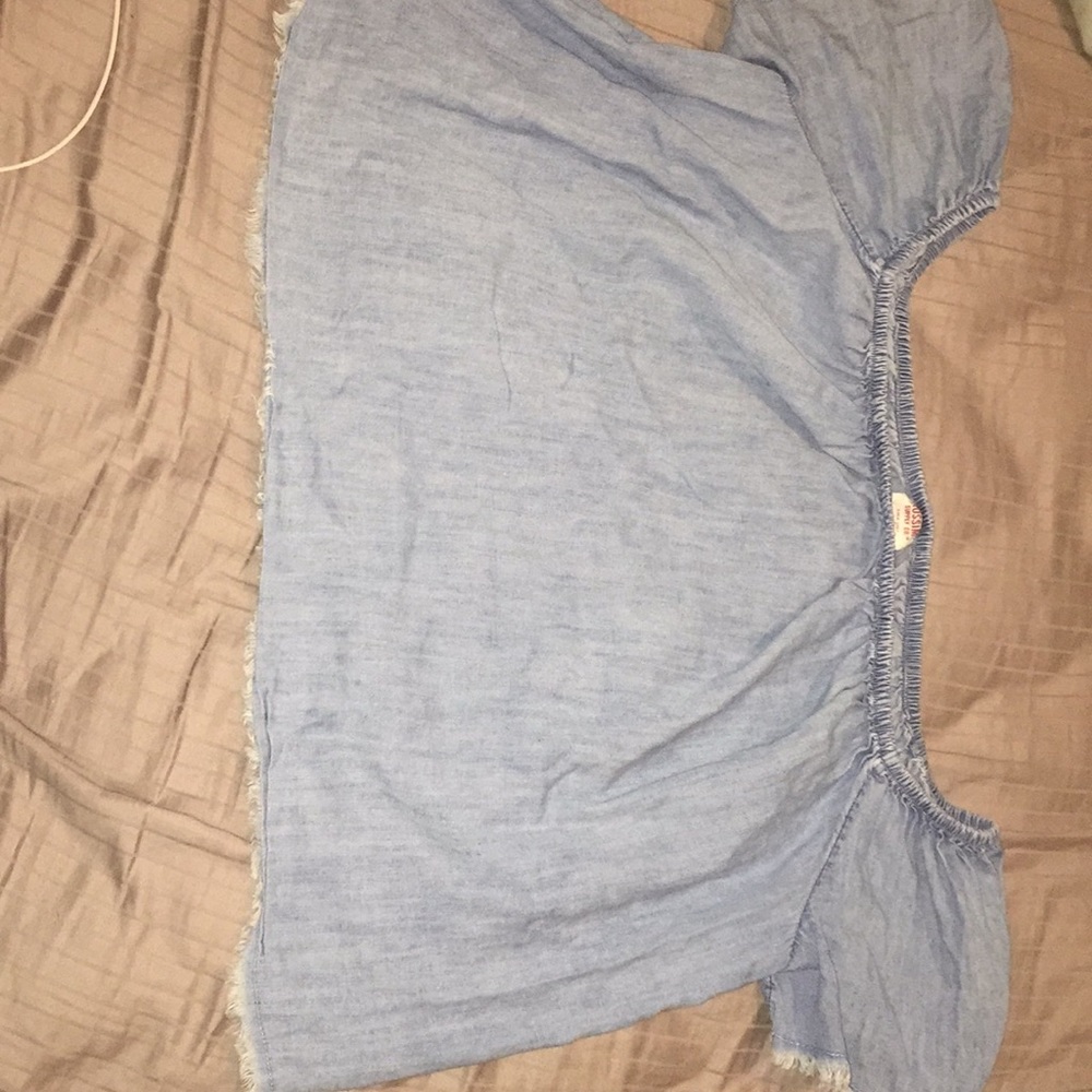 Light blue blouse.